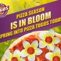 A pizza with flowers and text that reads "Pizza Season is in Bloom. Spring Into Pizza Tugos Today!"