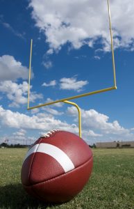 football in front of goal posts