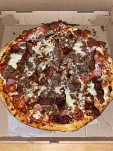 Cheeseburger pizza in the box