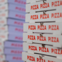 pizza boxes stacked up